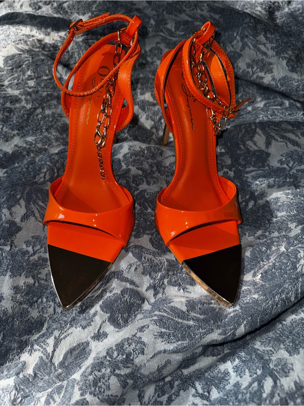 Bold Orange Pointed Ankle-Strap Heels with Chain Accent